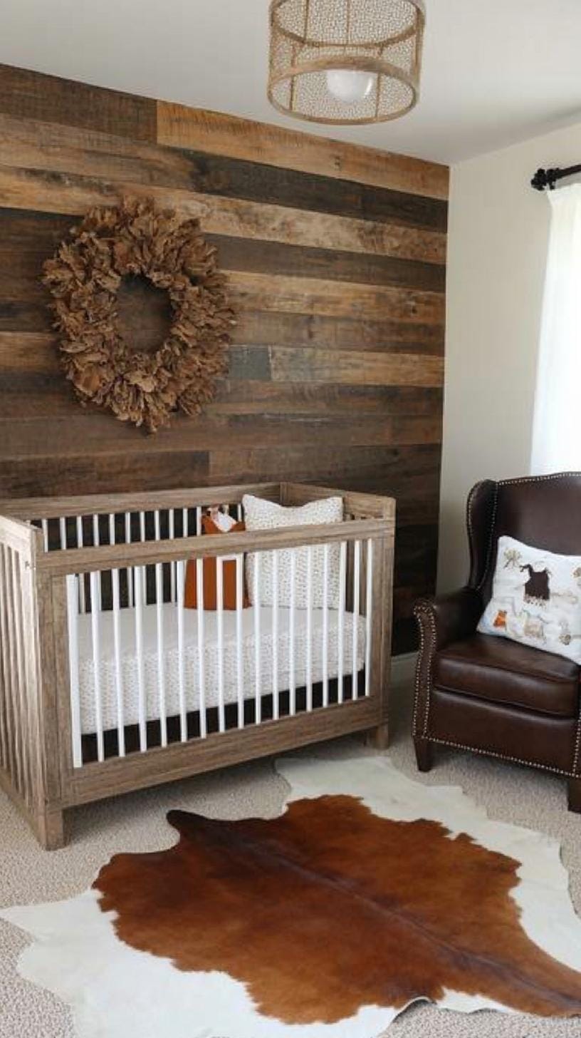 16. Rustic nursery with cowhide rug, wooden rocking chair, and horse decor-1