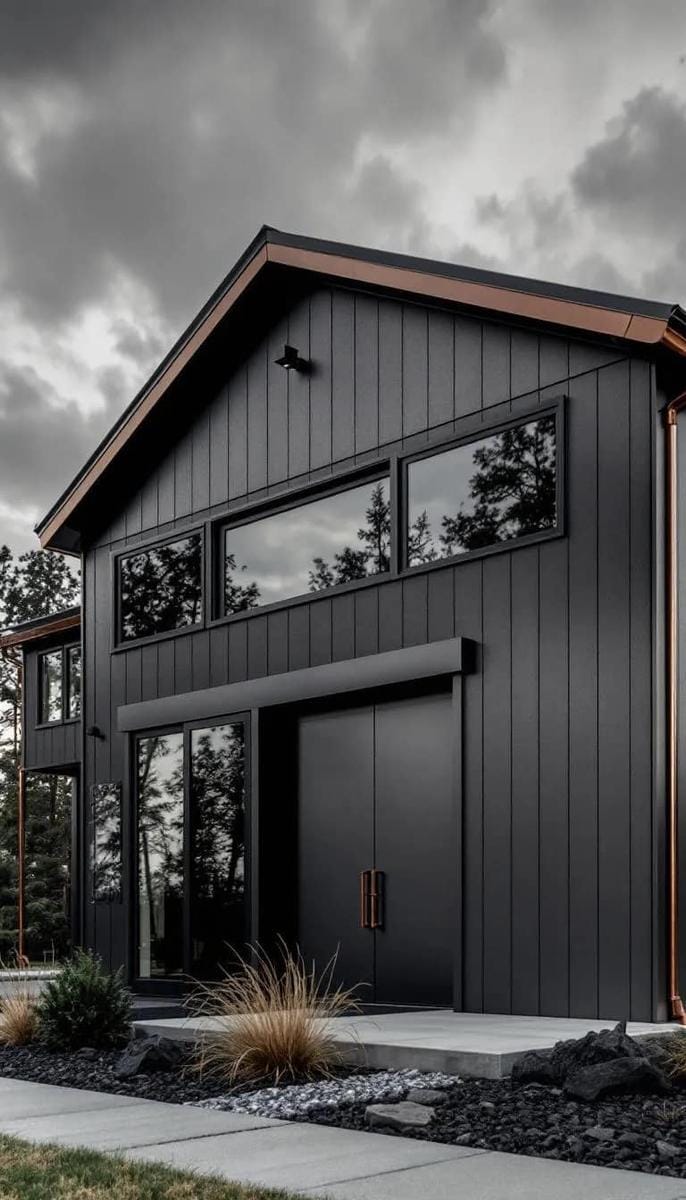 moody charcoal exterior highlighted by copper gutters and hardware 1