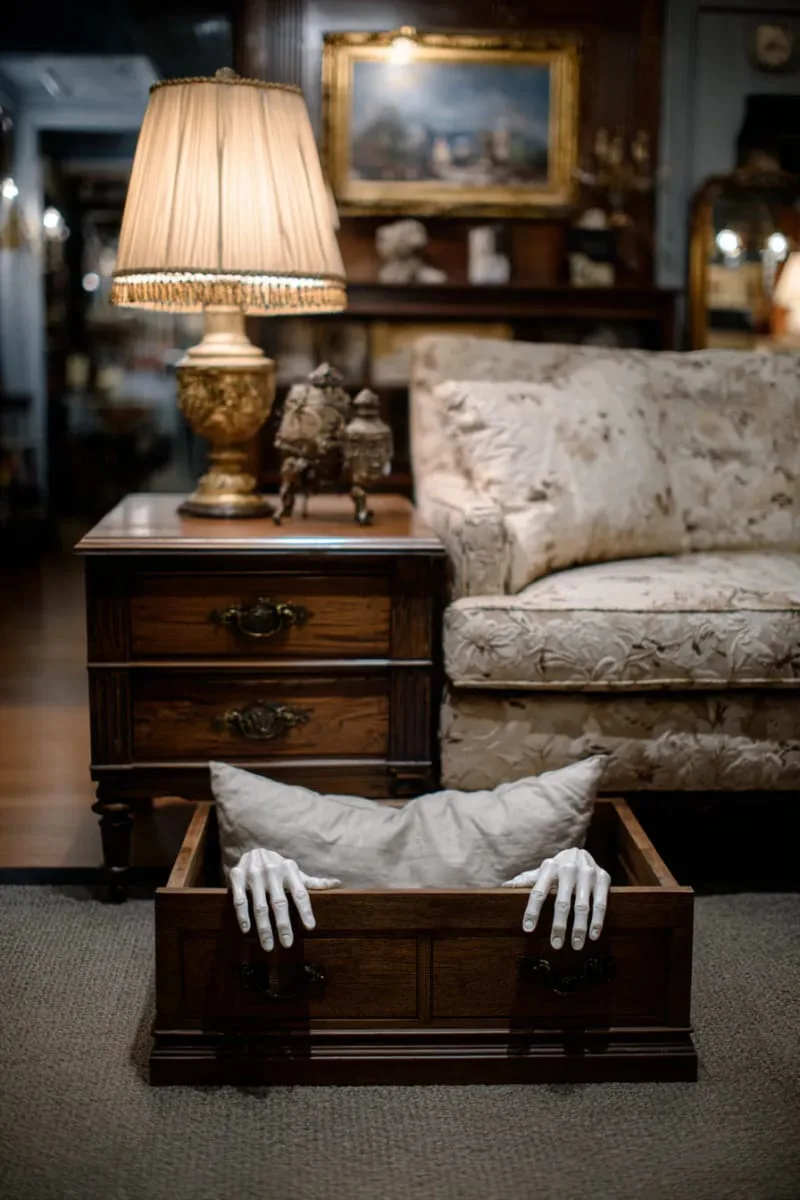 animated crawling hands emerging from beneath furniture 1
