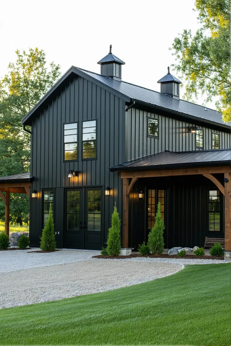 classic black barndominium with cedar wood accents and metal roof 1
