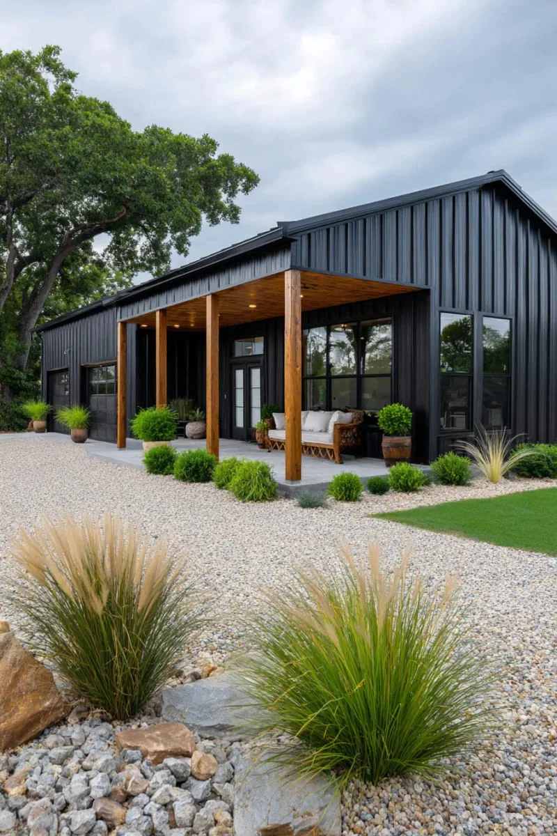 classic black barndominium with cedar wood accents and metal roof 1
