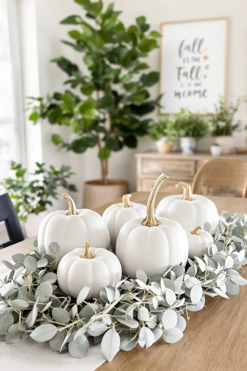 concrete pumpkins paired with eucalyptus garlands 1