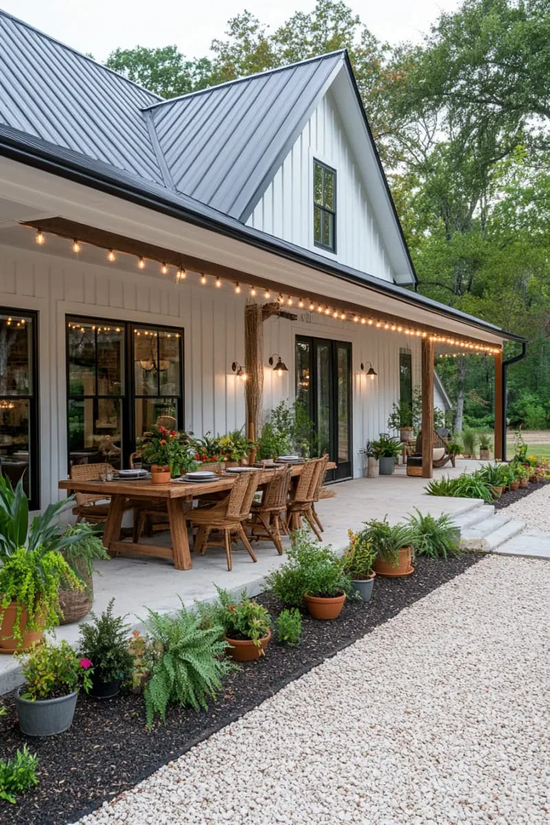 cozy barndominium with covered outdoor dining area and potted plants 1