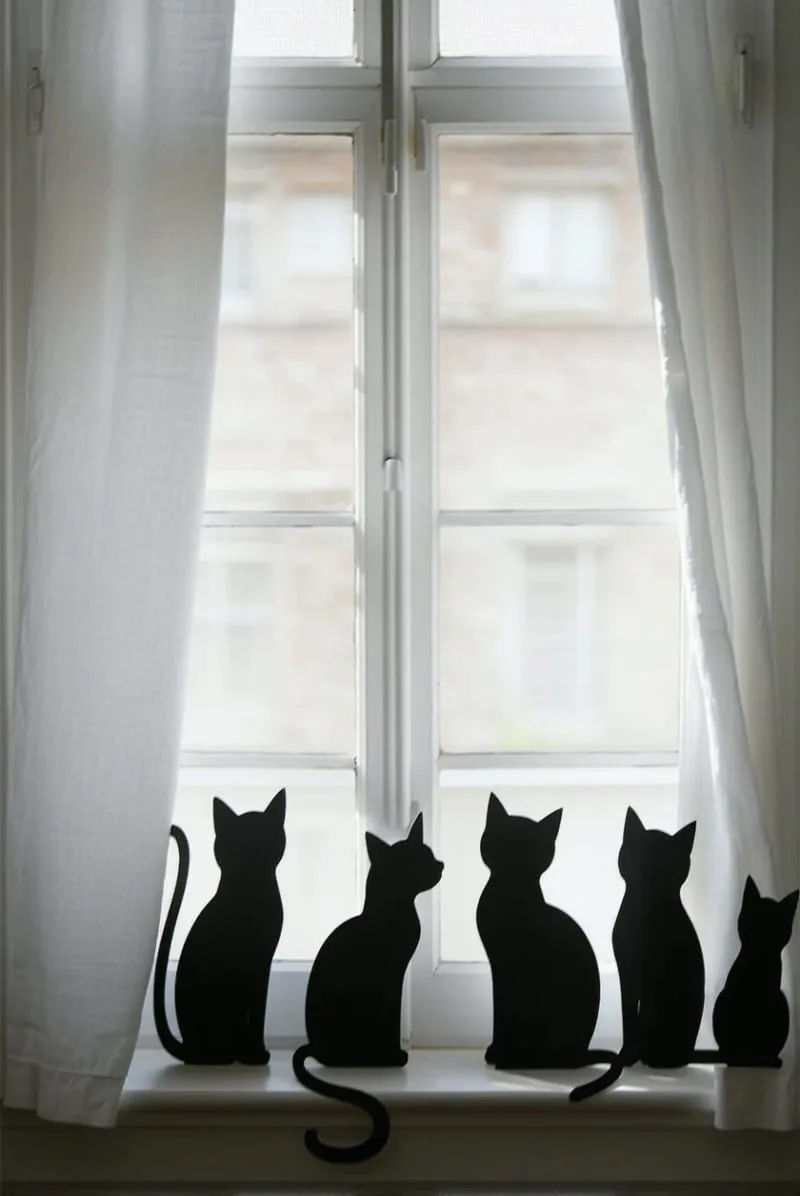 diy black cat silhouettes peeking from behind window curtains 1