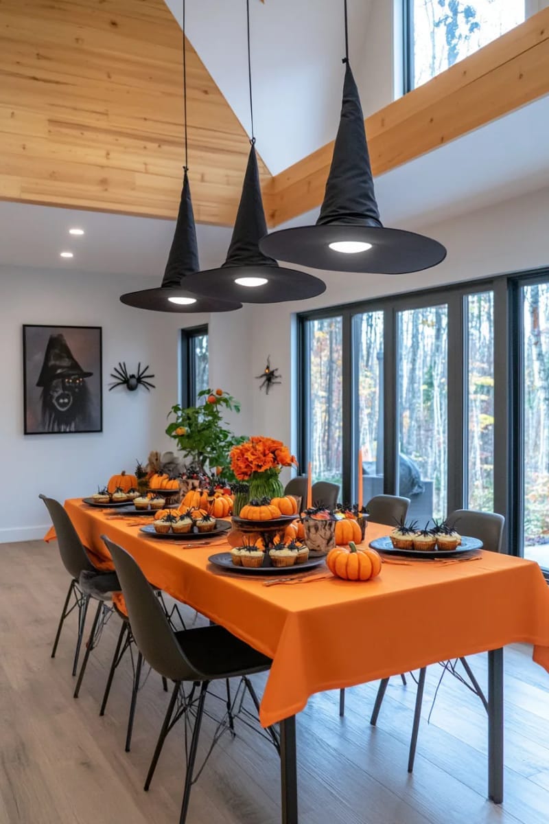 floating witch hats glowing with hidden led lights above the snack table 1
