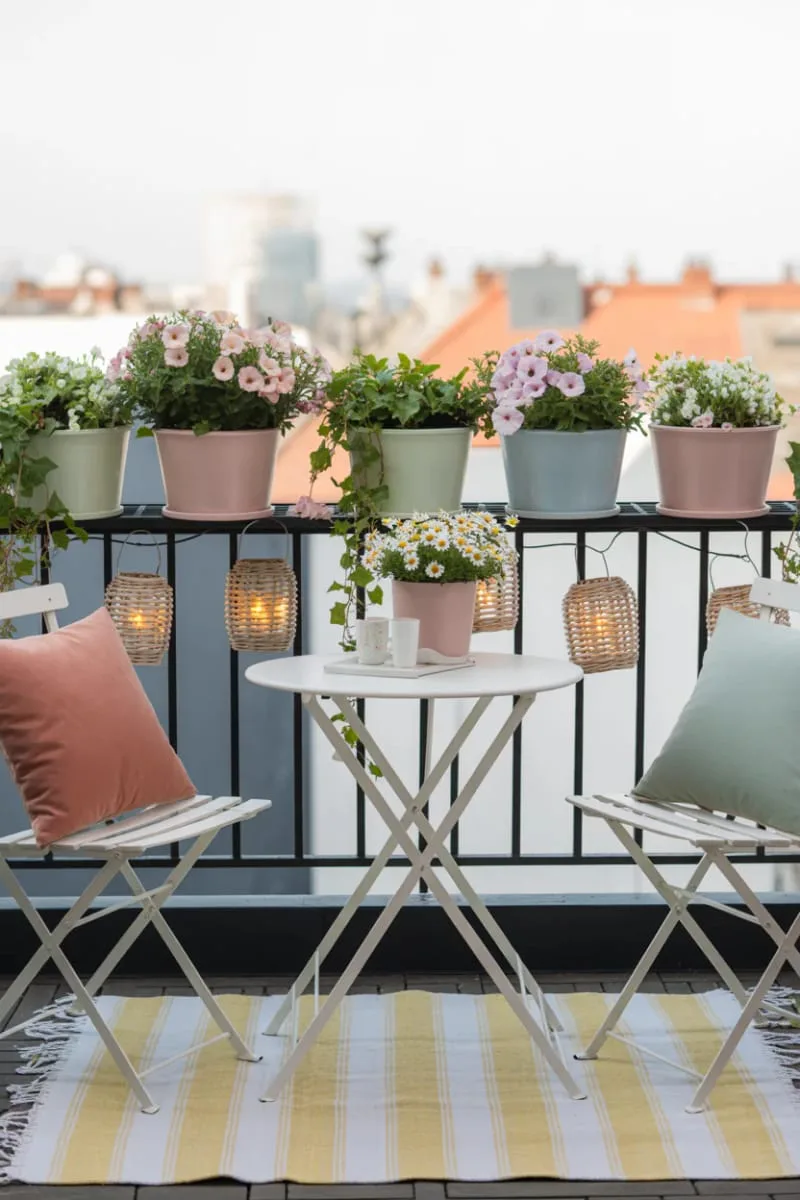 foldable bistro table with pastel flower pots 1