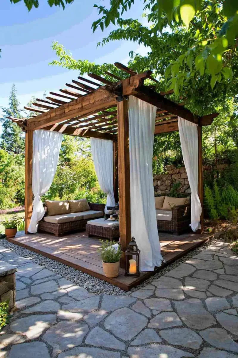 27 Unique Backyard Privacy Designs for A Serene Outdoor Oasis 15 freestanding outdoor curtains draped between pergola posts 1