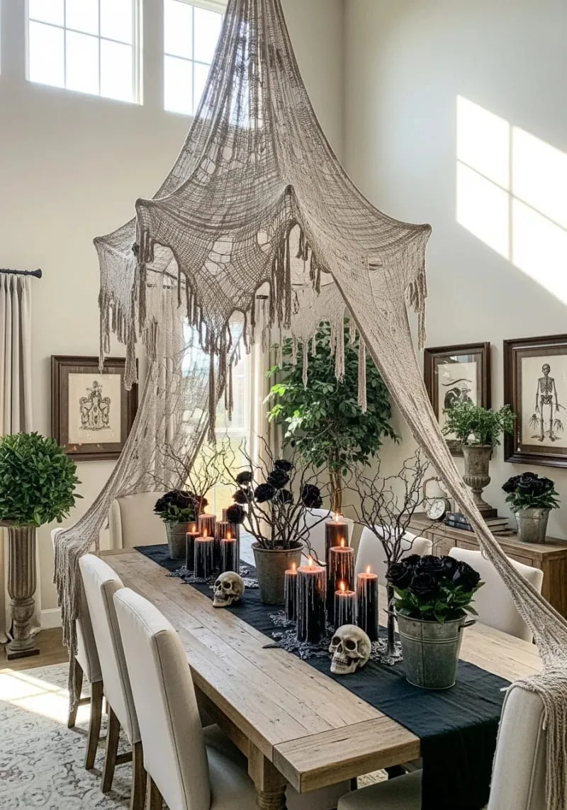 giant tattered spiderweb canopy over dining table 1