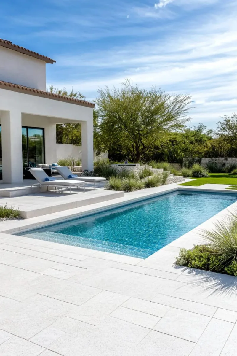minimalist modern beach entry pool with geometric lines and white stone 1