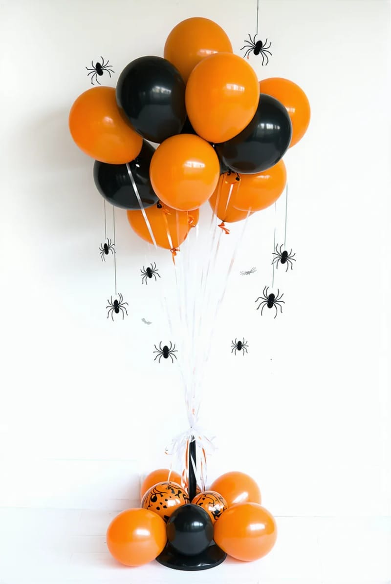 21 Simple Halloween Decorations for an Easy Seasonal Touch 46 orange and black balloon bunches with diy paper spiders 1