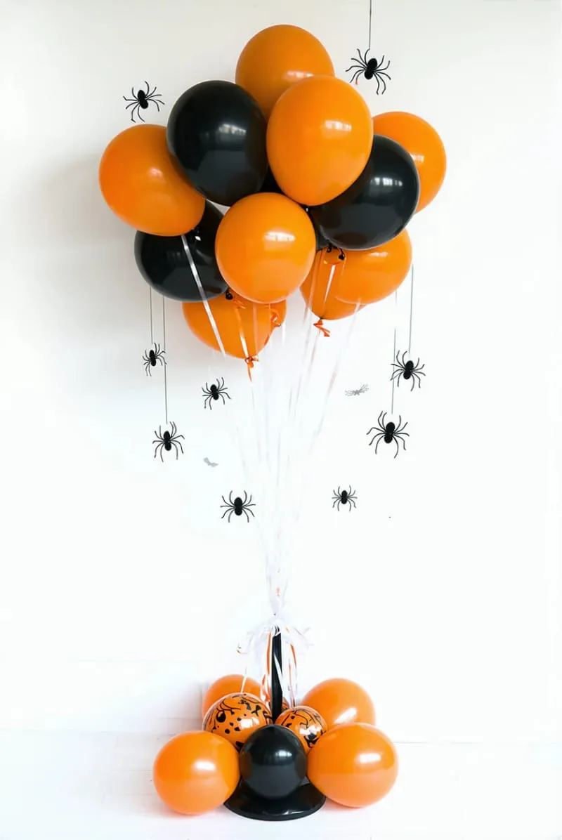 orange and black balloon bunches with diy paper spiders 1