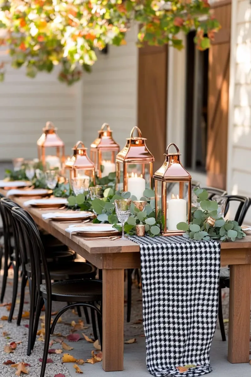 oversized houndstooth table runner with copper lanterns and eucalyptus 1