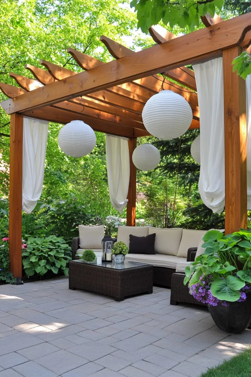27 Unique Backyard Privacy Designs for A Serene Outdoor Oasis 53 pergola draped in billowy white fabric and lanterns 1