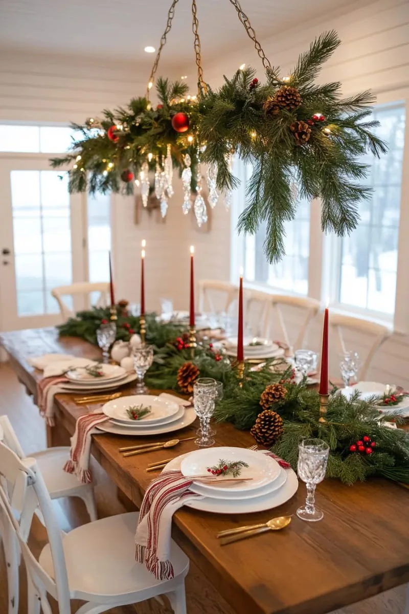 pine branch chandelier tied with velvet ribbons above the dining table 1