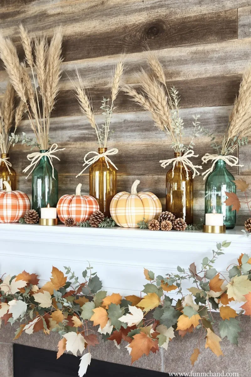 plaid fabric pumpkins with twine bows and vintage glass bottles 1