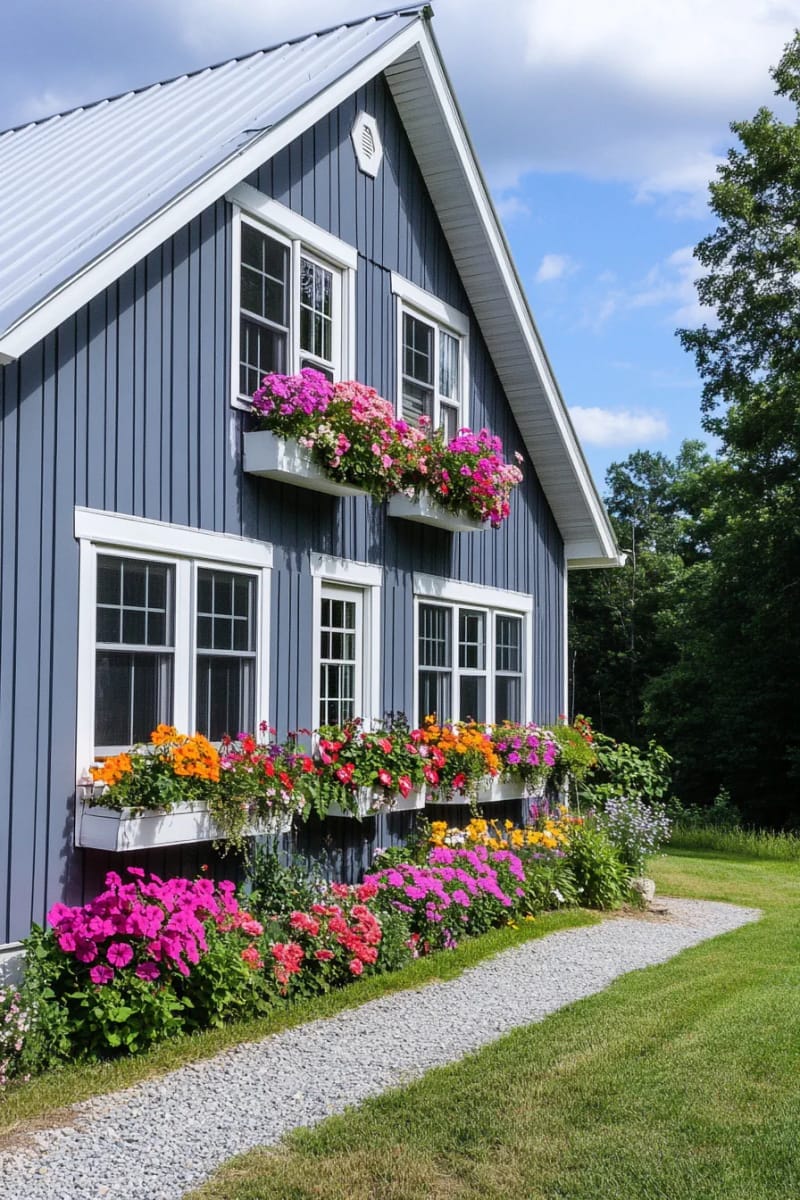 15 Simple Barndominium Exteriors for Modern Country Living 43 simple blue-gray facade with flower boxes under every window 1