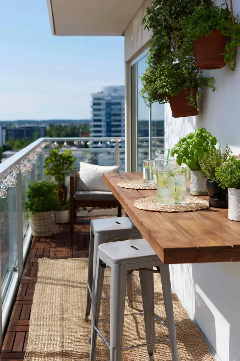 small balcony bar with mint and basil hanging above 1