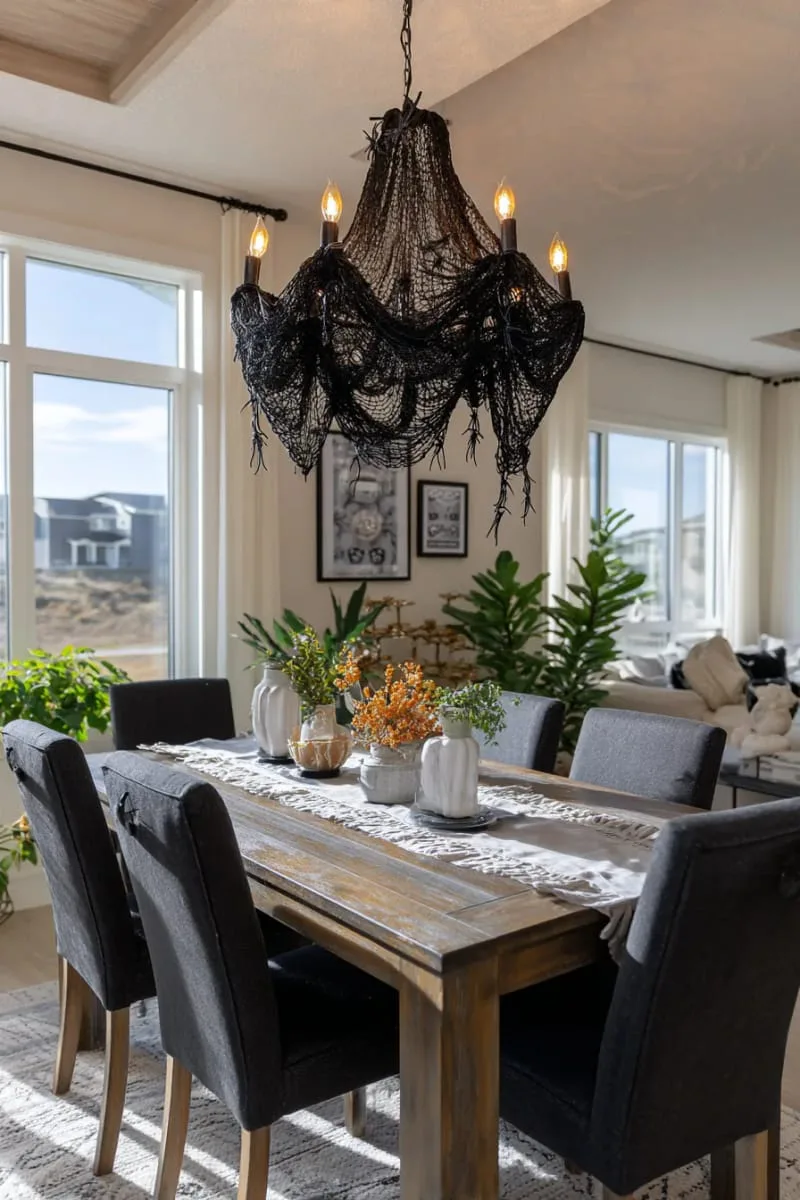 spooky chandelier made from black lace and dangling faux spiders 1