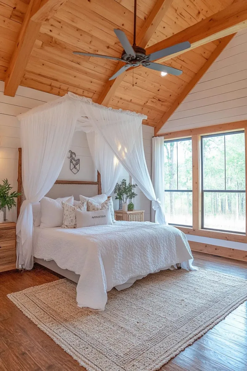 29 Unique Barndominium Interiors For Your Next Makeover 82 vaulted ceiling bedroom with canopy bed and rustic chandelier 1