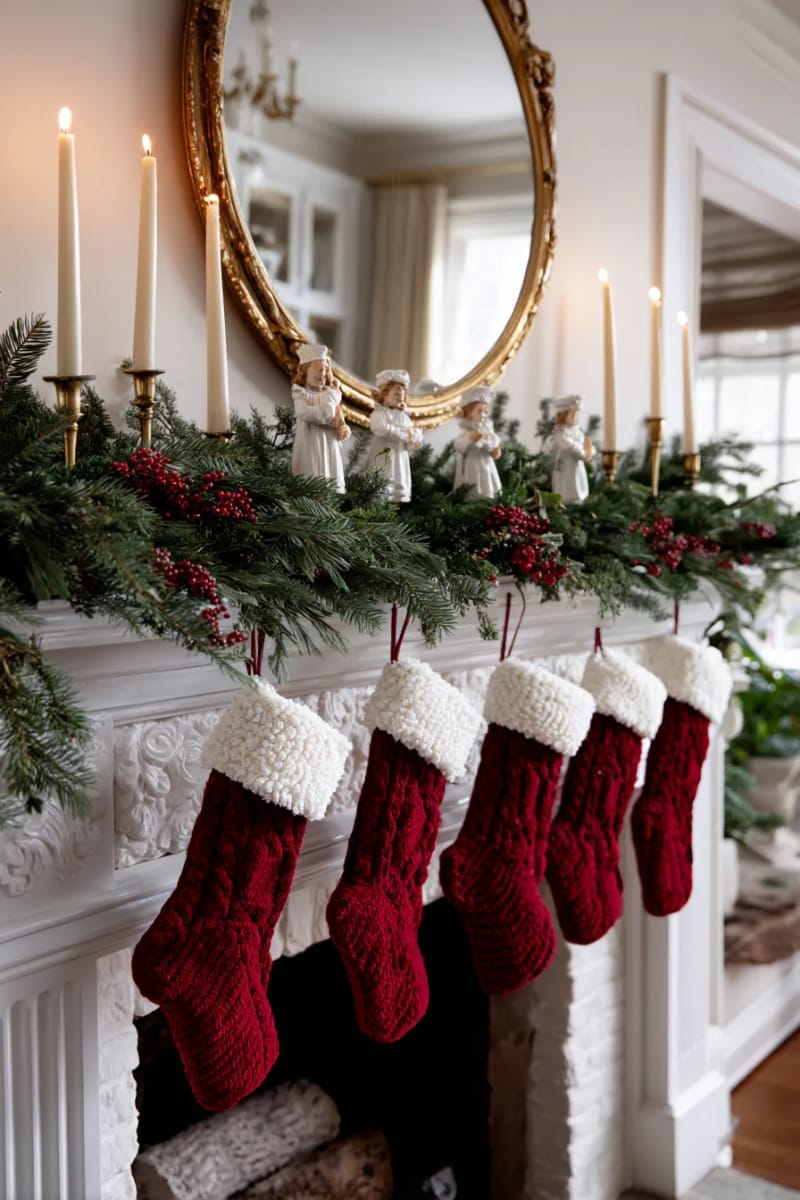 vintage-inspired mantel with red velvet stockings and pine garland accents 1