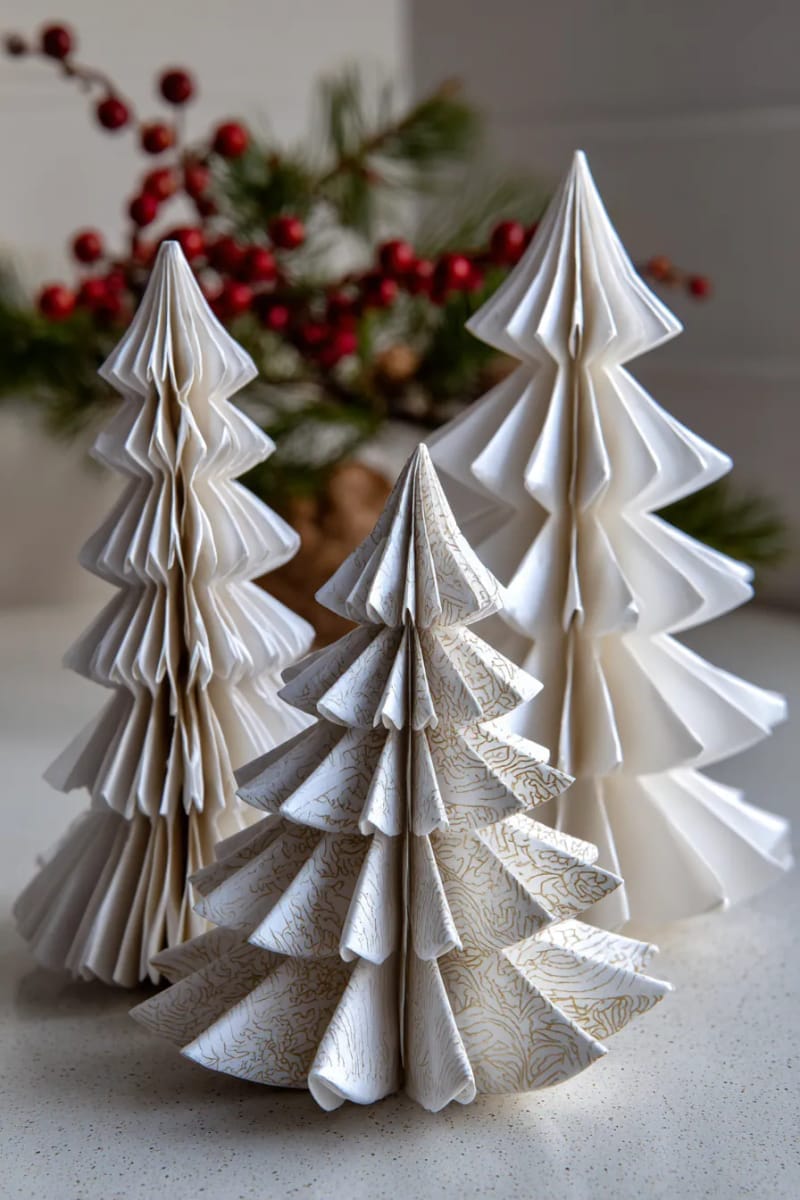 27 Unique Homemade Christmas Decorations You'll Love 27 3d origami paper christmas trees in snowy white for tabletop decor 1