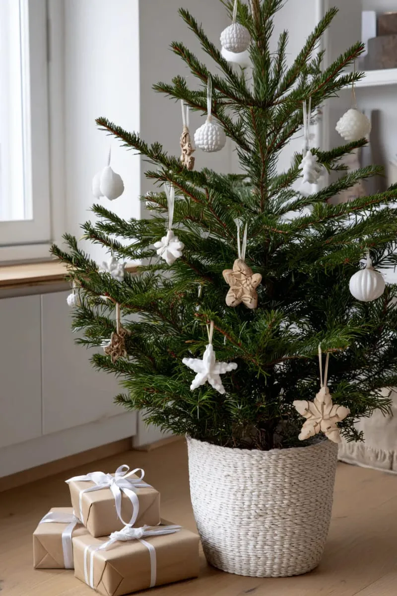 adorn a minimalist tree with only white and wooden ornaments for a chic vibe. 1