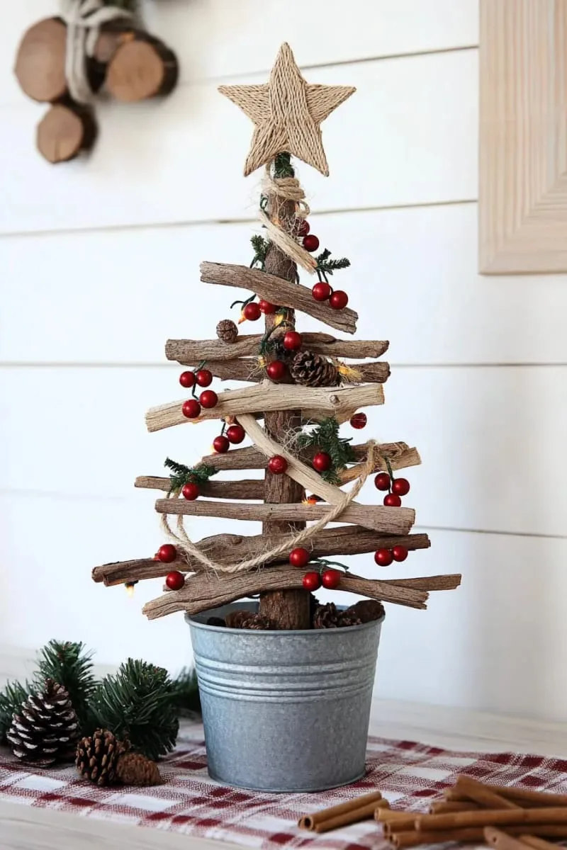 27 Sustainable Christmas Trees For Cheap and Eco-Friendly Decor 17 arrange driftwood branches into a unique, country christmas tree silhouette. 1