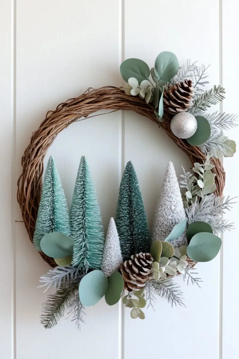 29 Best Christmas Decorations Trends You Can't Miss This Year 121 asymmetrical wreath covered in blue-green bottle brush trees 1