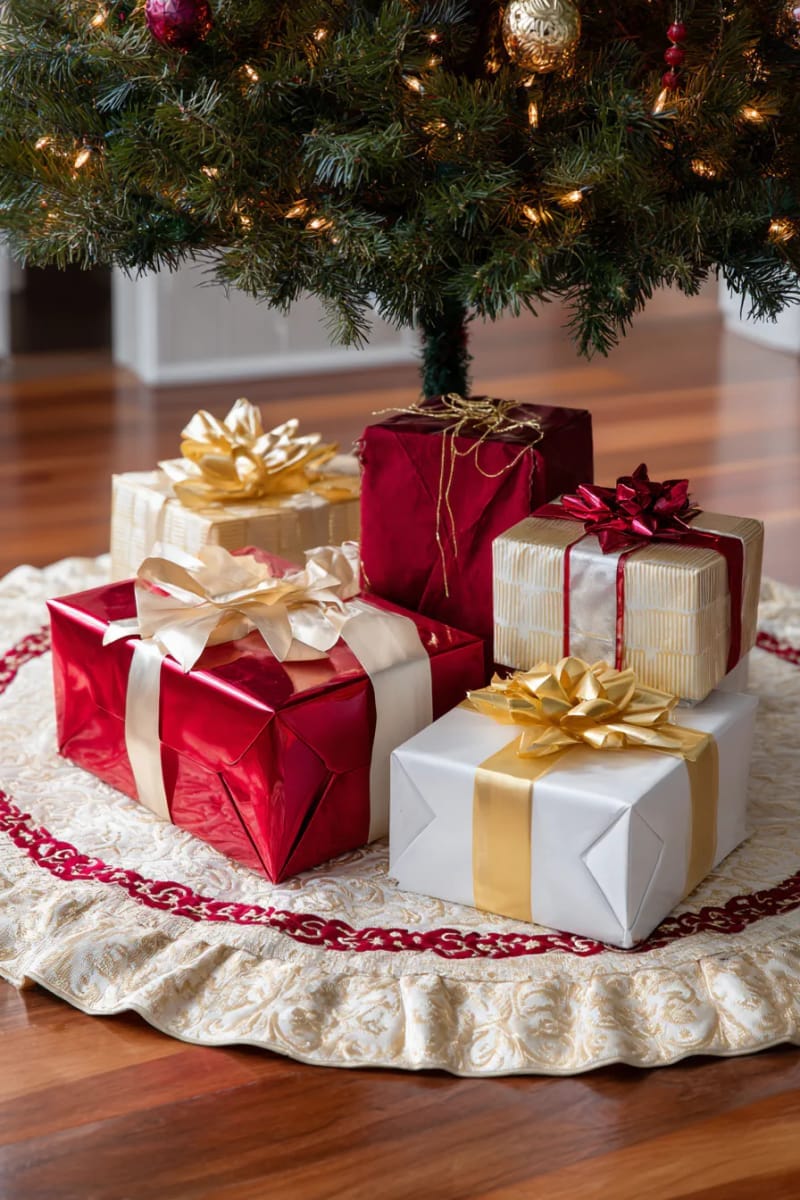 beautiful gold and red tree skirt with wrapped presents underneath 1