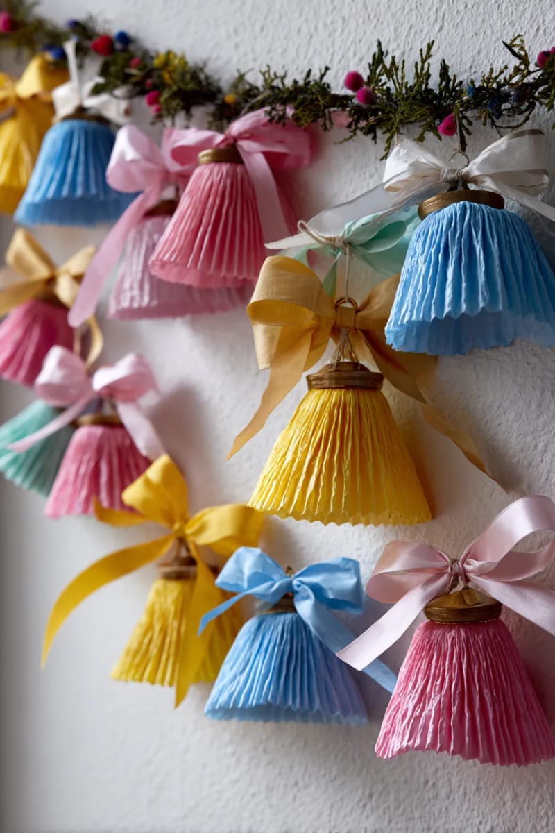 27 Unique Christmas Craft Decorations for Inspired Homes 126 crepe paper bells and bows for a playful party decoration wall 1
