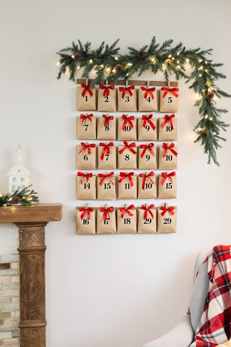 diy advent calendar with tiny numbered gift bags and red bows 1