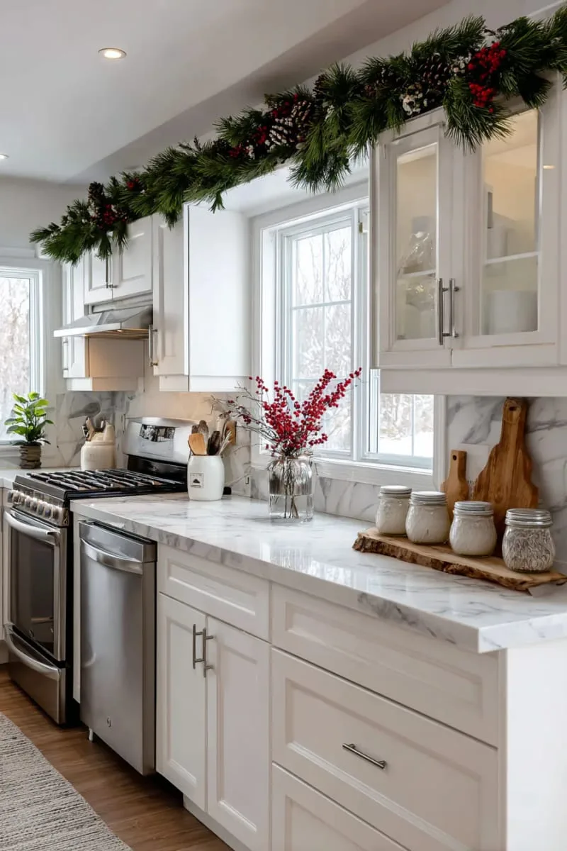 29 Creative Christmas Kitchen Decor Ideas You'll Absolutely Love 7 garland of fresh pine draped over kitchen cabinets or exhaust 1