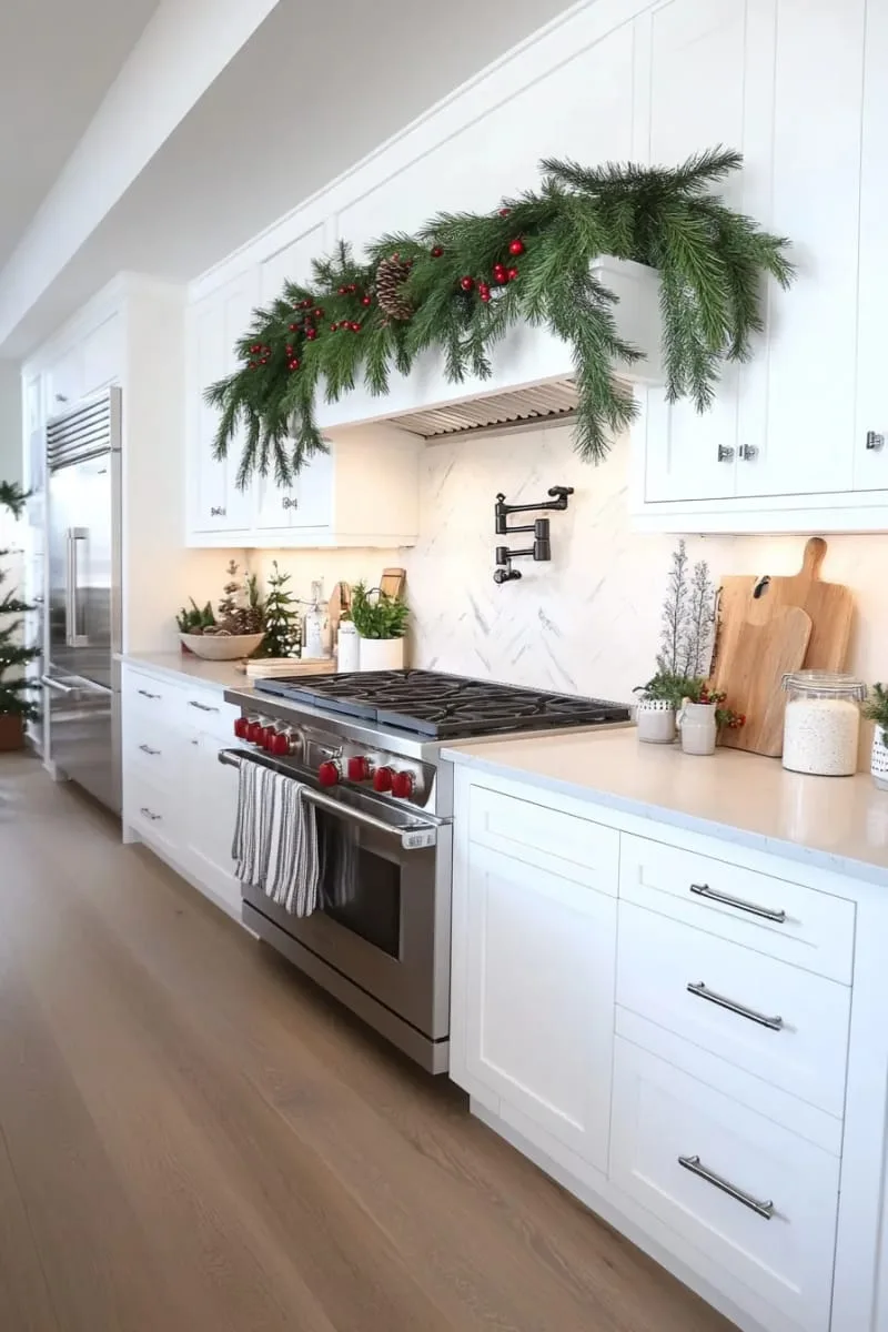 29 Creative Christmas Kitchen Decor Ideas You'll Absolutely Love 8 garland of fresh pine draped over kitchen cabinets or exhaust 1