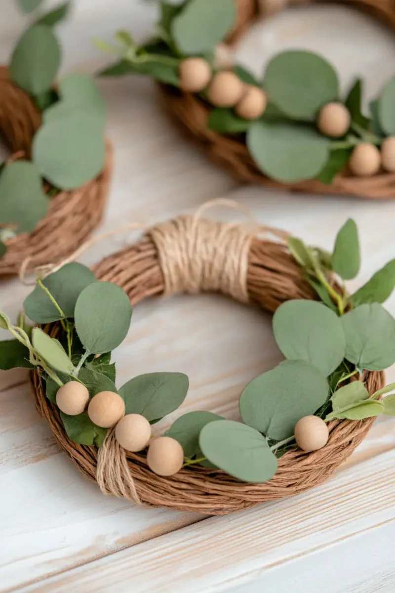 mini rustic wreaths with eucalyptus and wooden beads for natural vibes 1