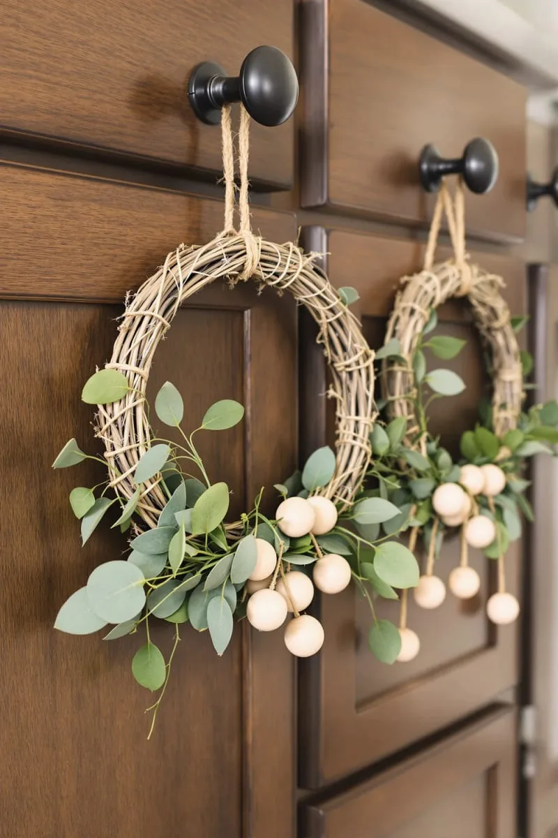 mini rustic wreaths with eucalyptus and wooden beads for natural vibes 1