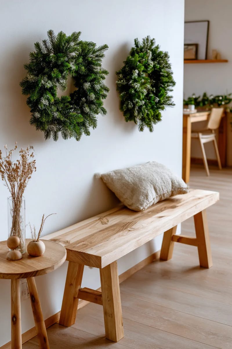 minimalist christmas decor featuring simple pine wreaths and natural wood accents 1