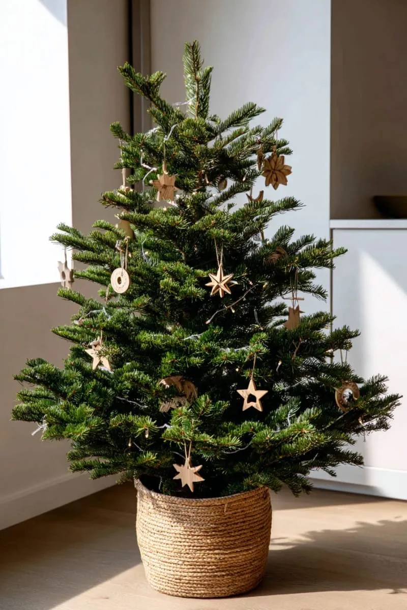 minimalist tree with natural wood ornaments and soft white lights 1