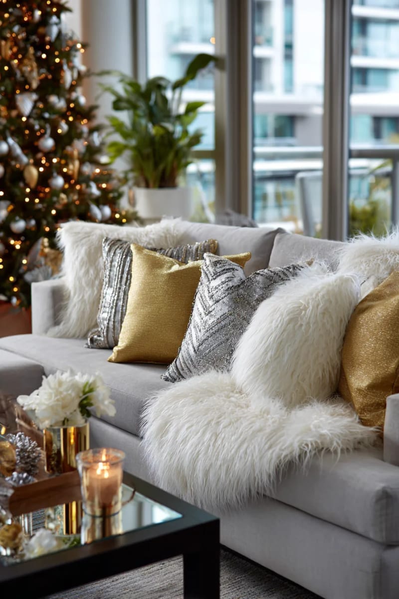 mix faux fur throws and metallic gold pillows for a glamorous holiday vibe 1