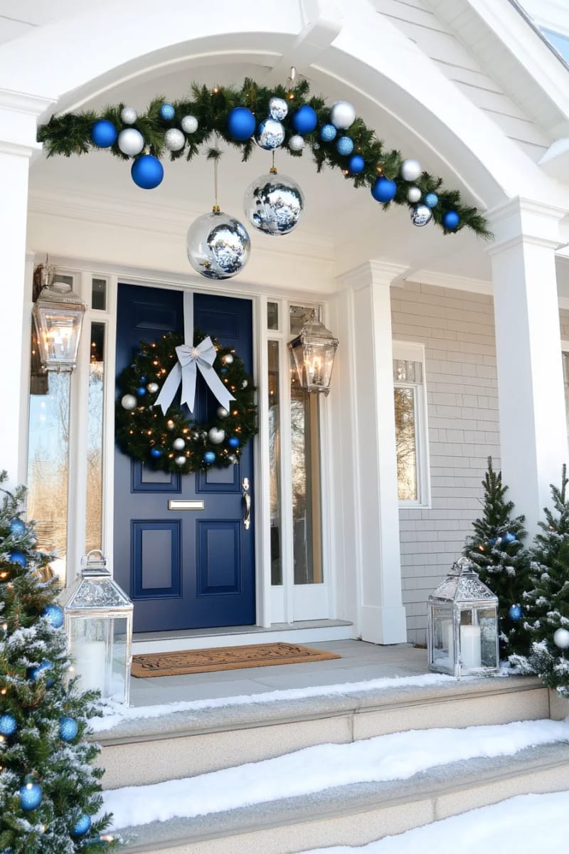 29 Festive Christmas Door Decor Ideas for a Magical Entry 63 monochrome blue and silver bauble garland with star-shaped fairy lights 1