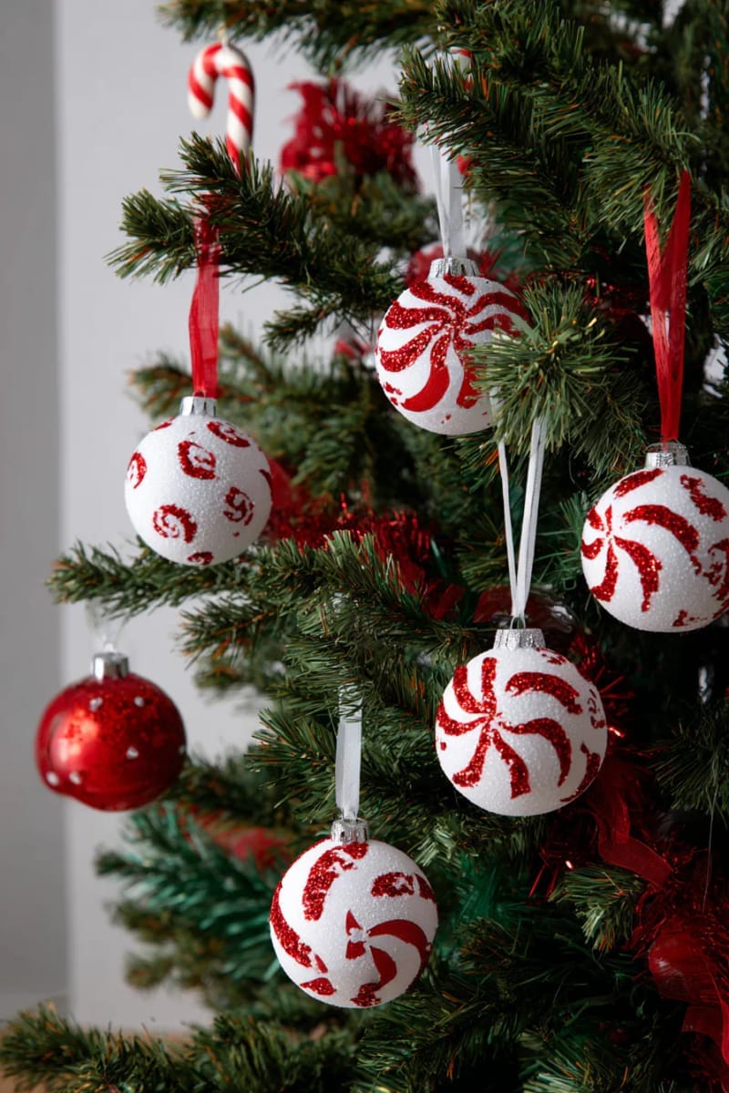 27 Unique Homemade Christmas Decorations You'll Love 10 peppermint swirl paper ornaments for a candy cane tree theme 1