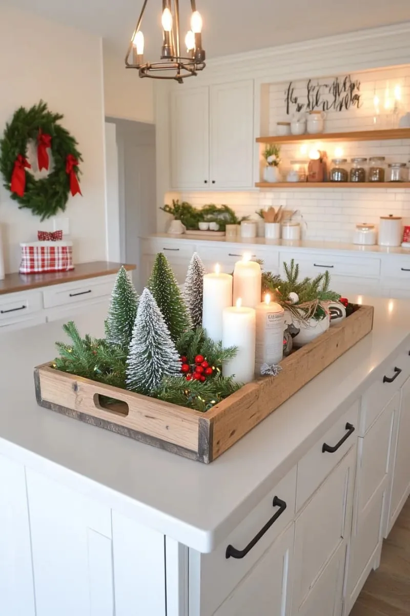 rustic wood tray with mini flocked trees, candles, and pine sprigs 1