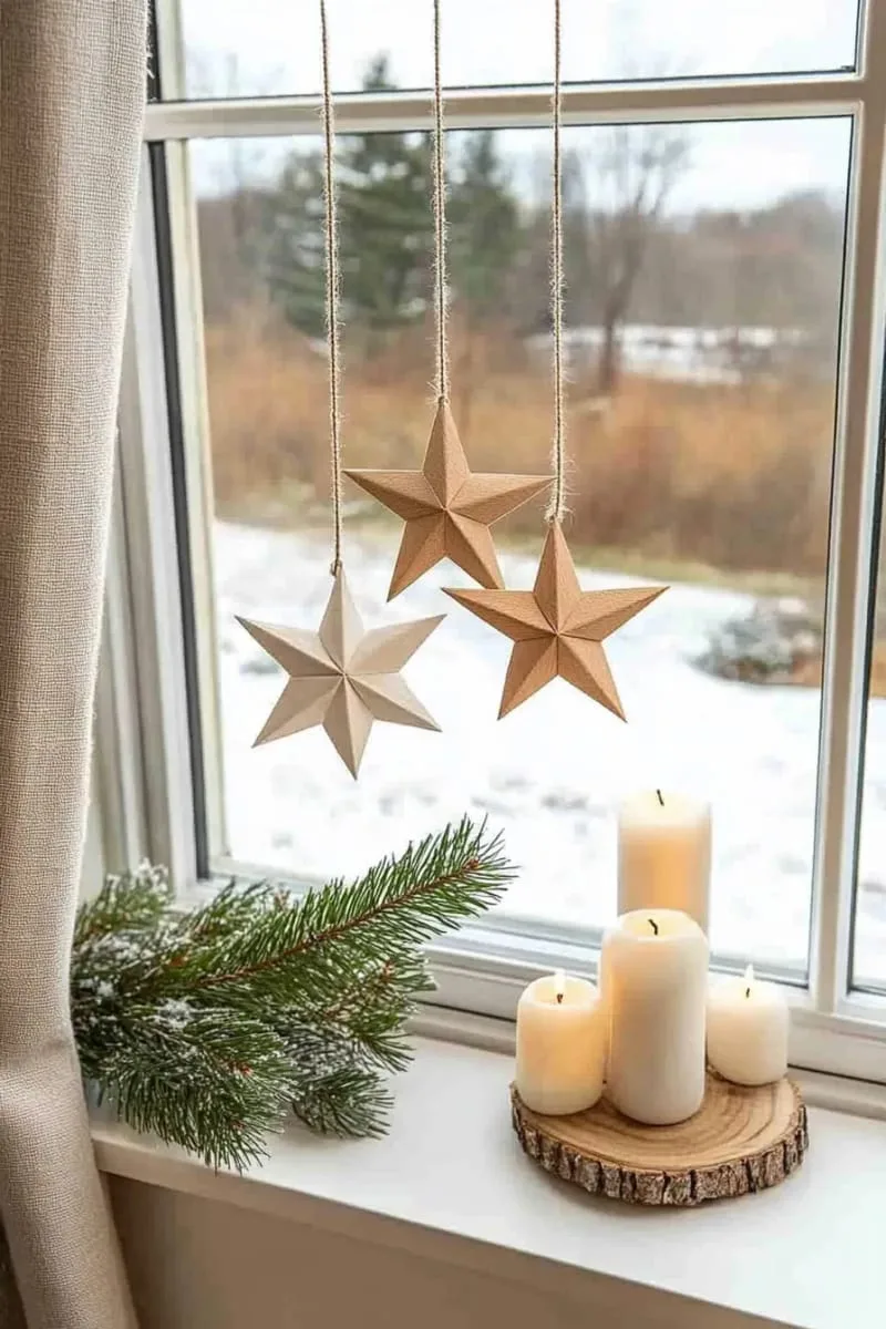 25 Best Christmas Window Decor Ideas to Try This Year 41 scandinavian-inspired paper stars hanging at various heights across the glass. 1