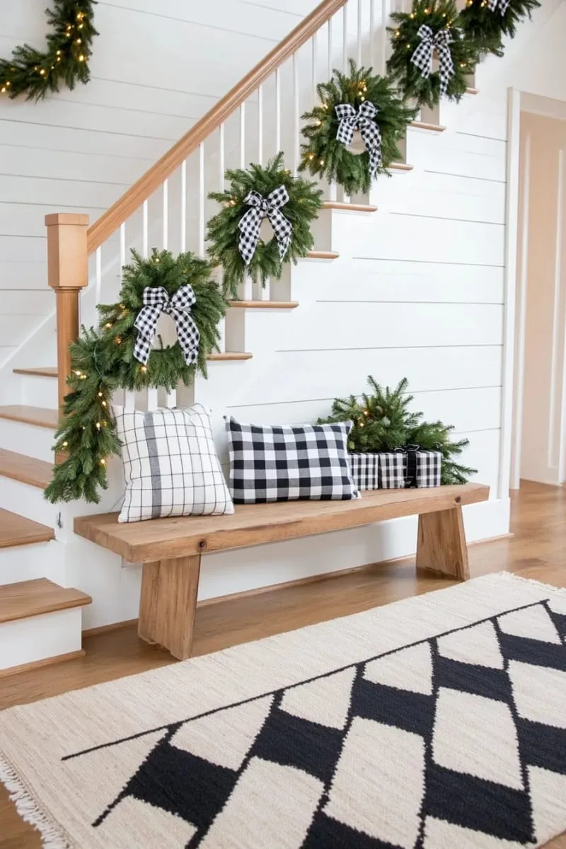 simple greenery wreaths with black-and-white gingham bows on every door 1