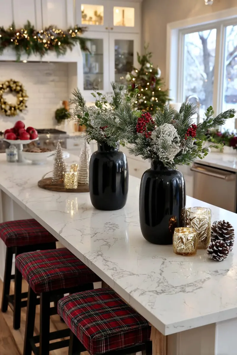 sleek black vases with holly berries and evergreen sprigs for a modern touch 1