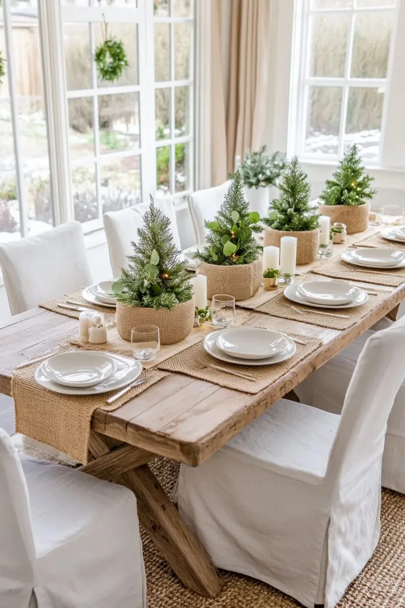 small fir trees in burlap-wrapped pots for the dining table 1