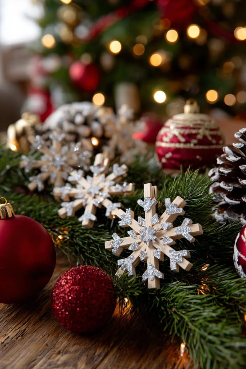 25 Upcycled Christmas Crafts DIY: Unique & Budget Friendly Decor Ideas 100 wooden clothespin snowflake ornaments dusted with silver glitter 1