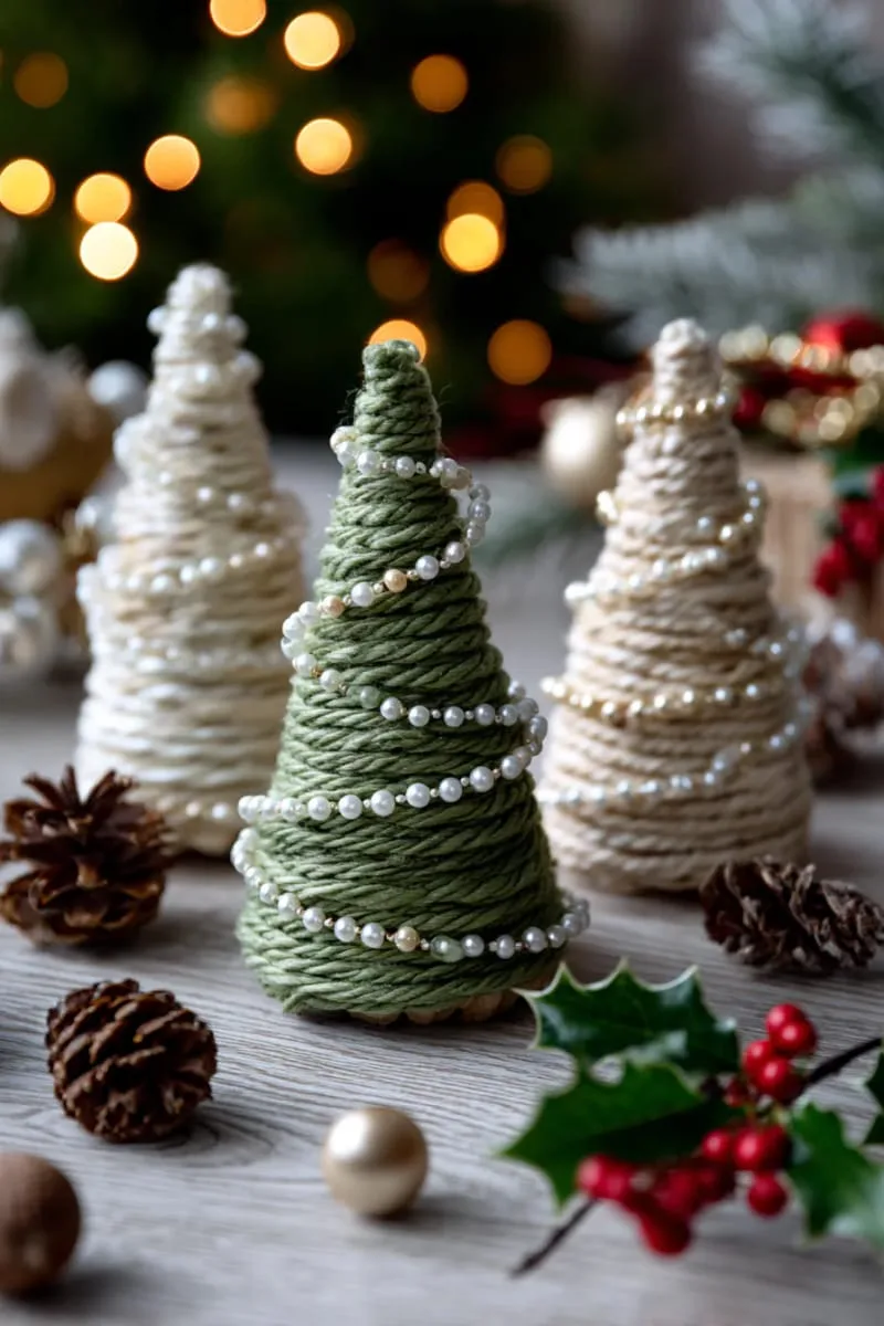 25 Upcycled Christmas Crafts DIY: Unique & Budget Friendly Decor Ideas 101 yarn-wrapped cardboard trees with pearl bead garlands 1