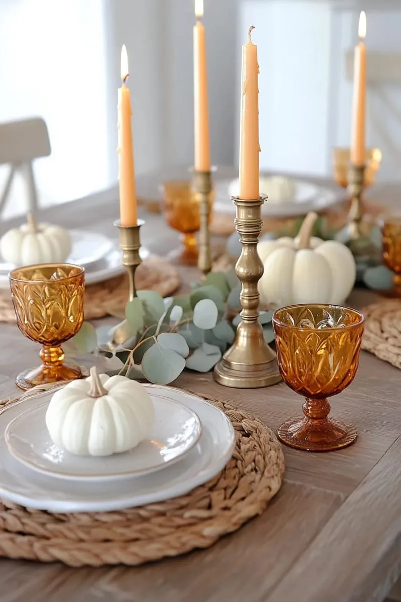 antique brass candlesticks paired with orange taper candles 1