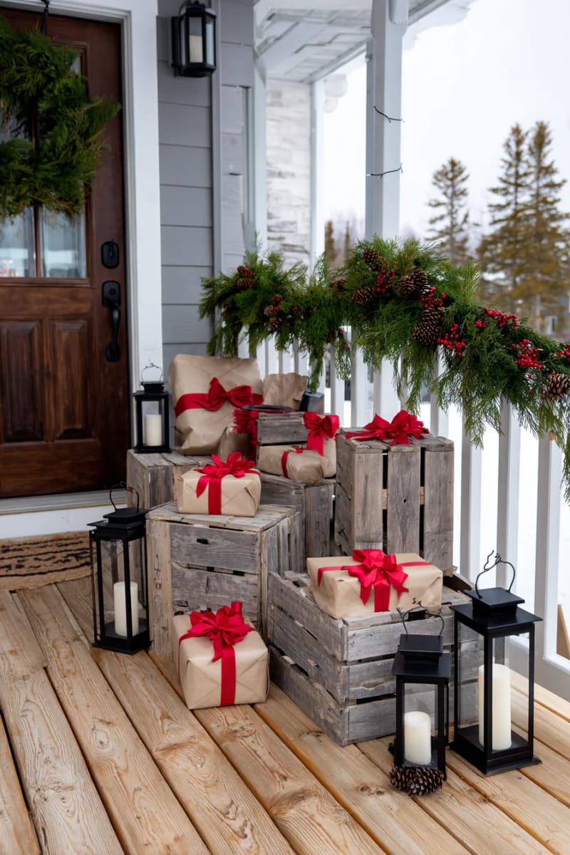 antique wooden crates stacked with wrapped faux gifts and lanterns 1