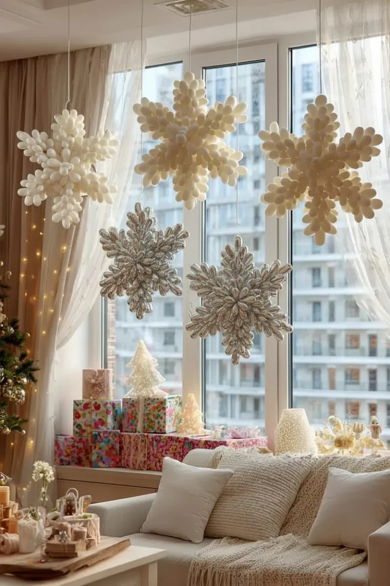 21 Christmas Balloon Decor Ideas for a Fun and Festive Holiday 41 balloon snowflakes in white and silver for a winter wonderland effect 1